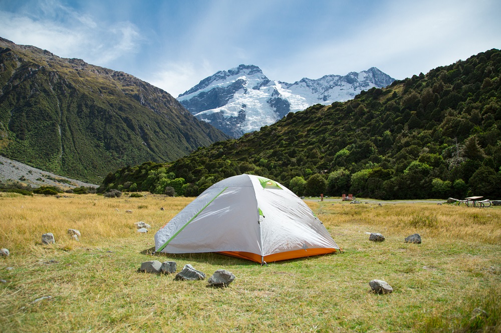 Tent camping in New Zealand with Mount Cook in the background.